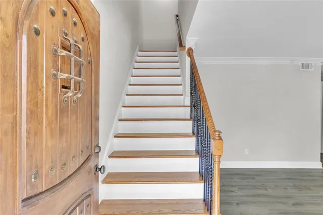a view of entryway with wooden floor and windows