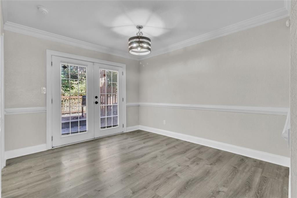 4430 Tilly Mill Road, Unit 206 Atlanta, GA 30360 - Photo 8 of 29 wooden floor in an empty room with a window
