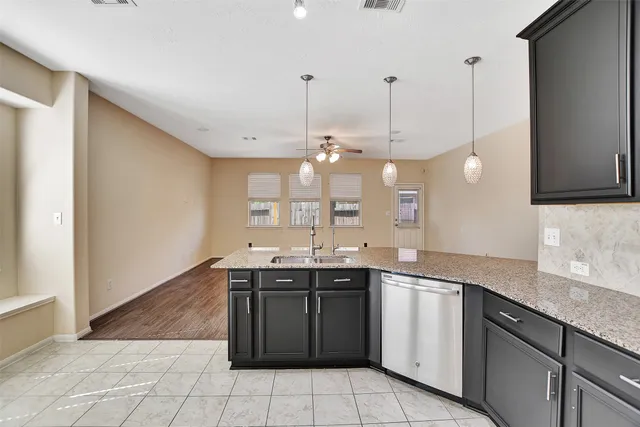 a view of a hallway with windows and stairs