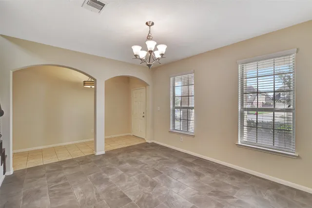 a view of a kitchen with a sink dishwasher and a fireplace with wooden floor