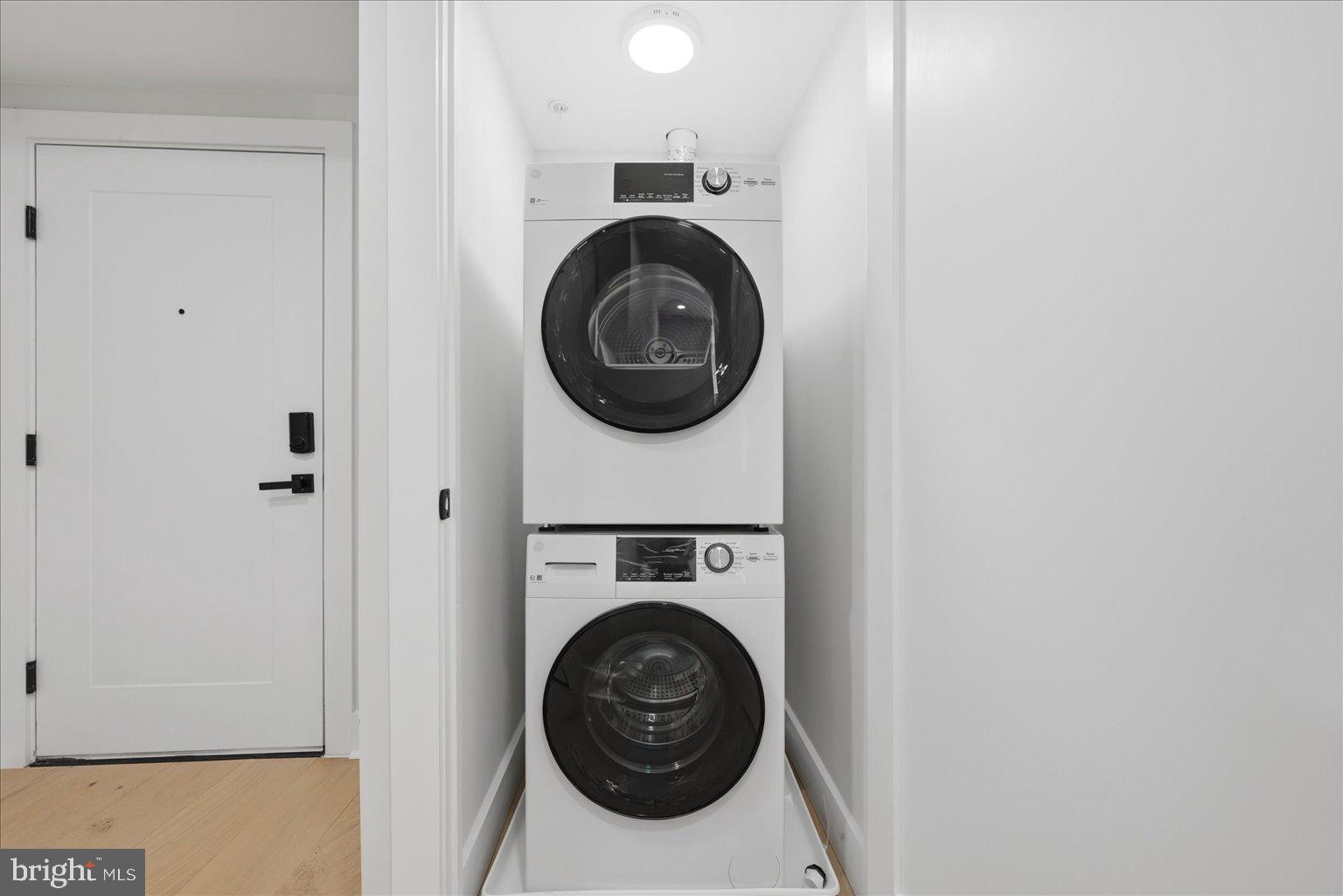 919 12th Street Northeast, Unit 404 Washington, DC 20002 - Photo 11 of 17 a utility room with dryer and washer