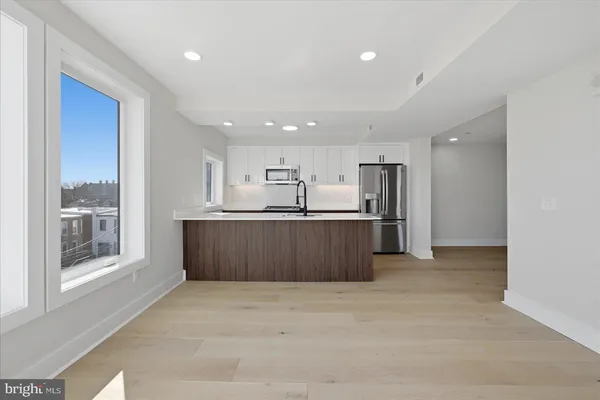 a view of kitchen with wooden floor