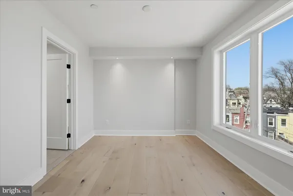 a view of an empty room with a window