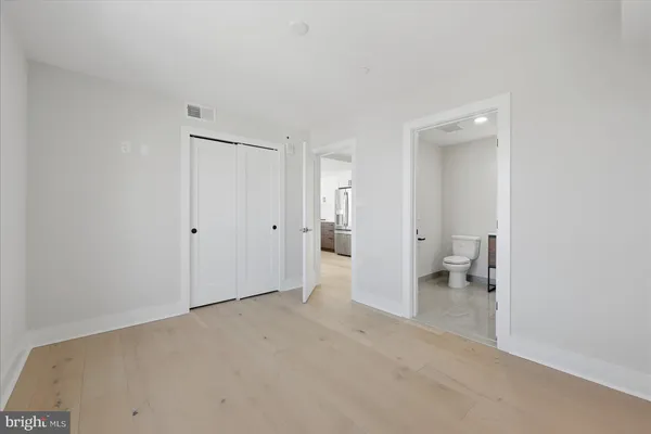 a view of a room with a closet and a toilet