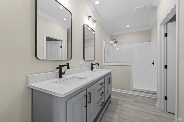 a view of empty room with wooden floor and windows