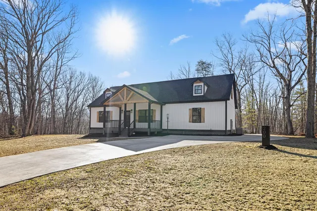 a view of a house with a snow in the yard