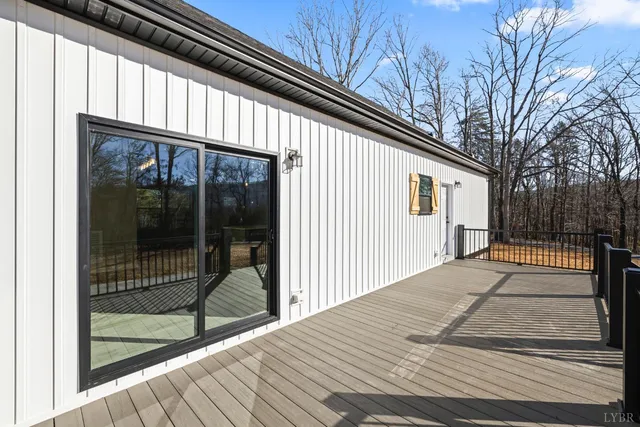 a kitchen with kitchen island white cabinets and stainless steel appliances