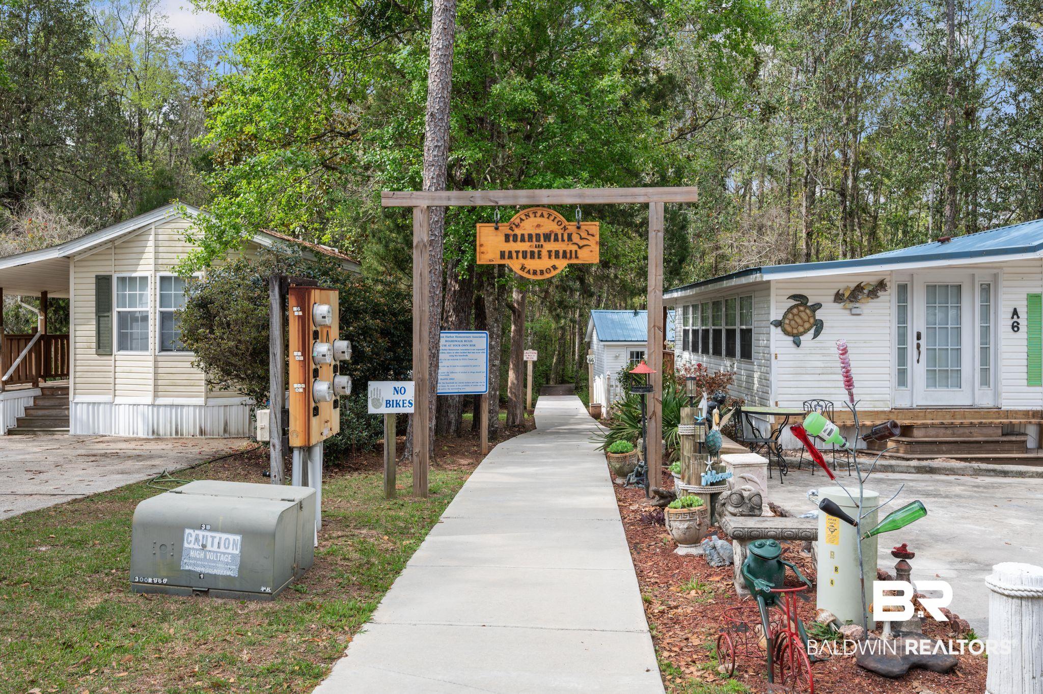 24711 County Road 20, Unit A11 Elberta, AL 36530 - Photo 26 of 35 View of home's community with entry steps and view of wooded area