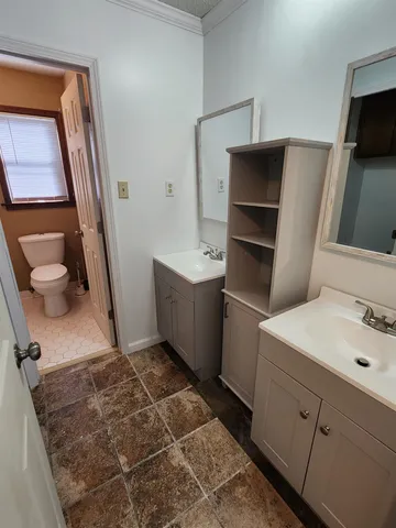 a bathroom with a sink toilet and tub