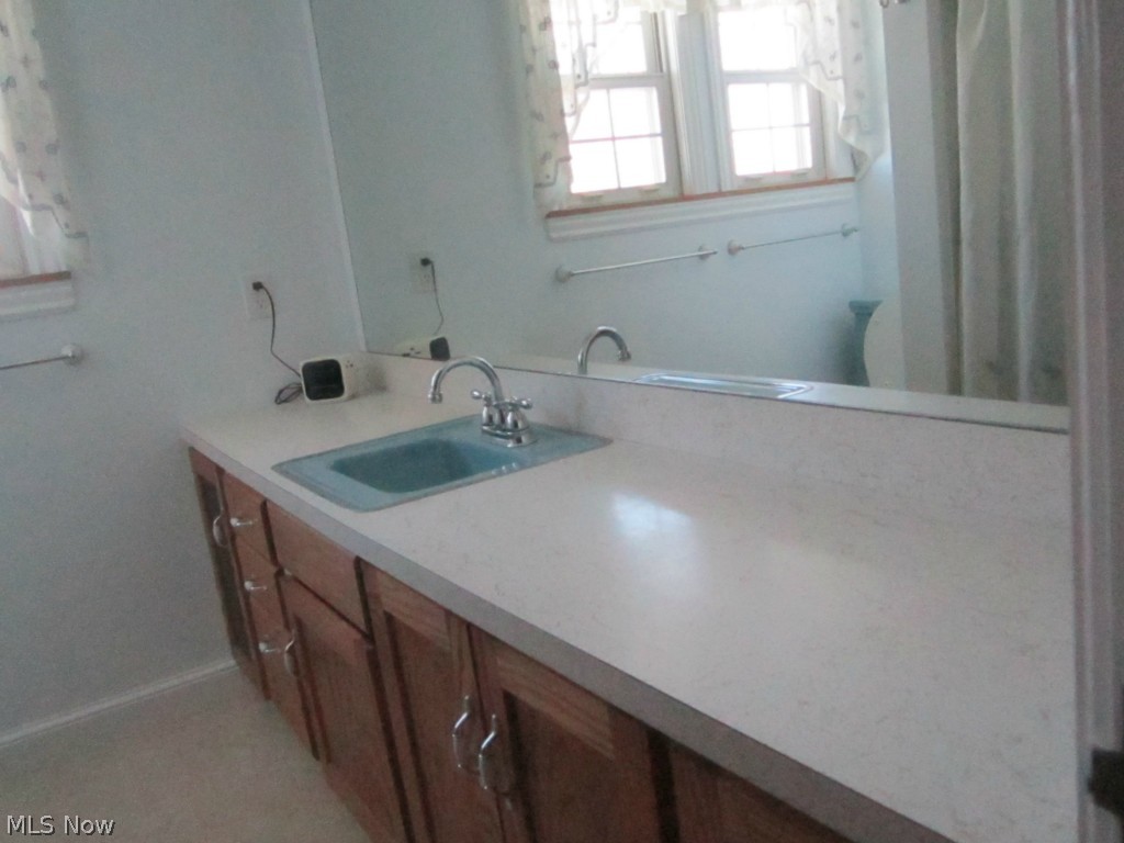 233 East Schaaf Road Independence, OH 44131 - Photo 15 of 22 Second floor full bath has a tub, shower and lots of oak cabinets.