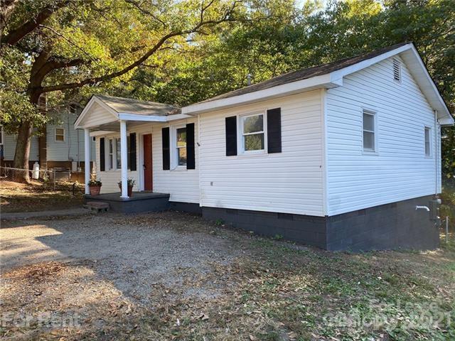 517 West Henry Street Belmont, NC 28012 - Photo 1 of 7 a view of a house with a backyard