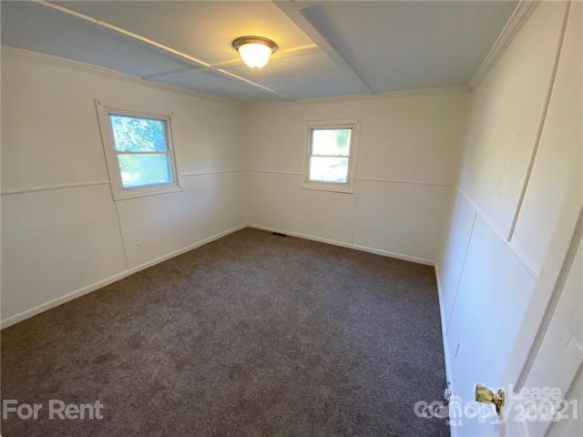 517 West Henry Street Belmont, NC 28012 - Photo 5 of 7 a view of an empty room with a window