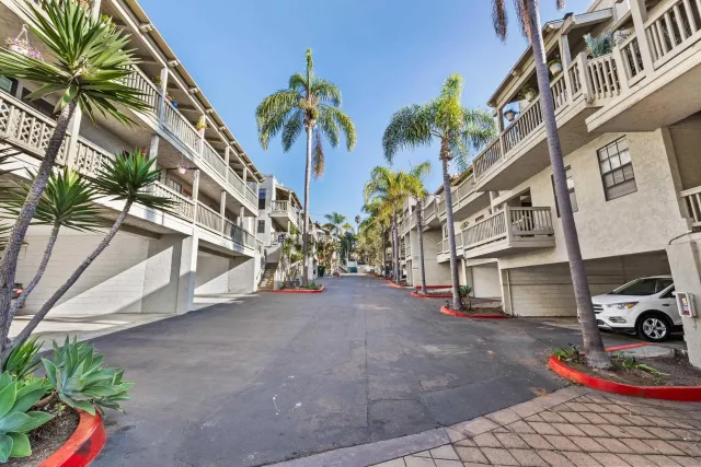 a view of a street with a building in the background