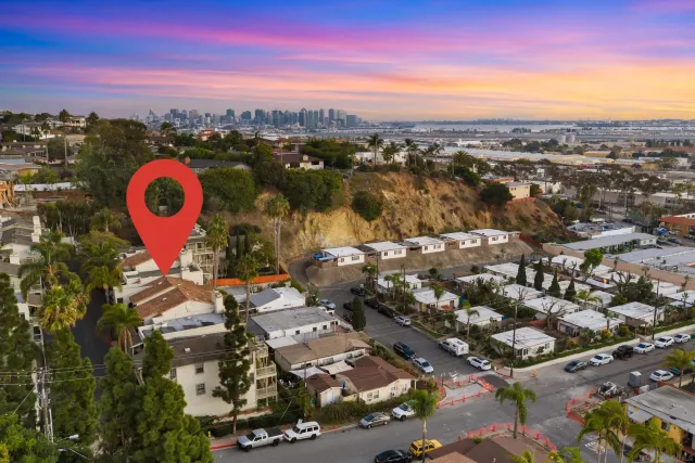 an aerial view of residential building with trees