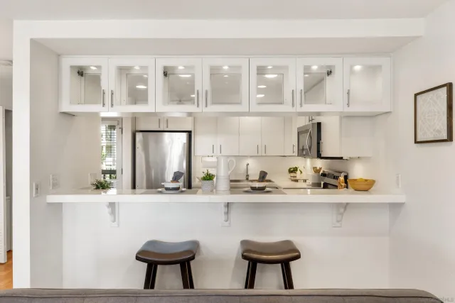 a kitchen with a sink and cabinets