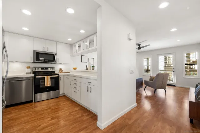 a kitchen with a sink stainless steel appliances and cabinets