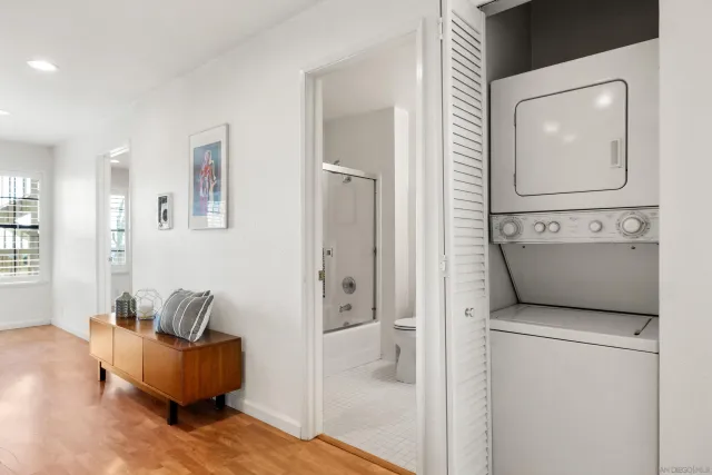 a living room with furniture and a mirror