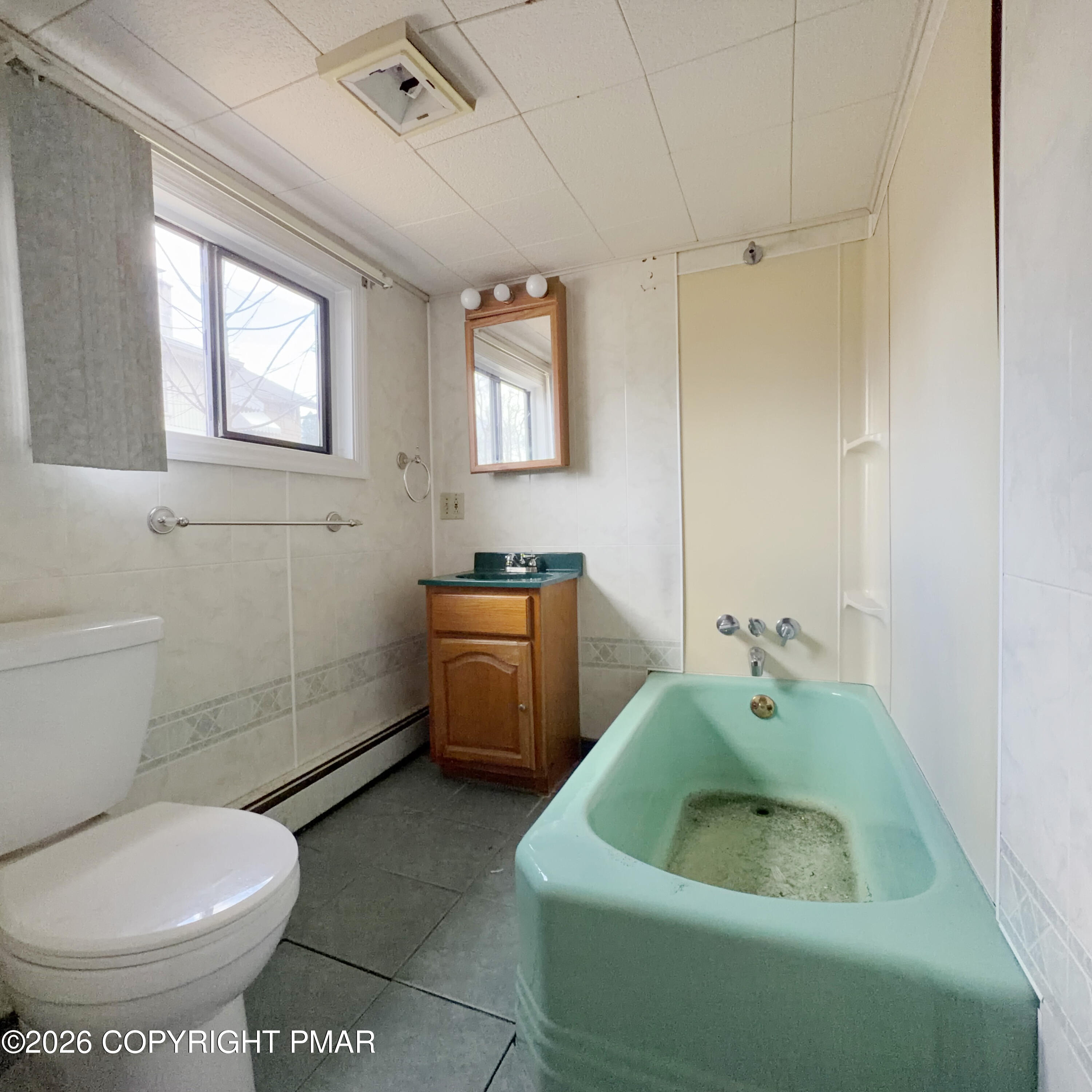 180 Parsonage Street Pittston, PA 18640 - Photo 11 of 19 a bathroom with a sink toilet and window