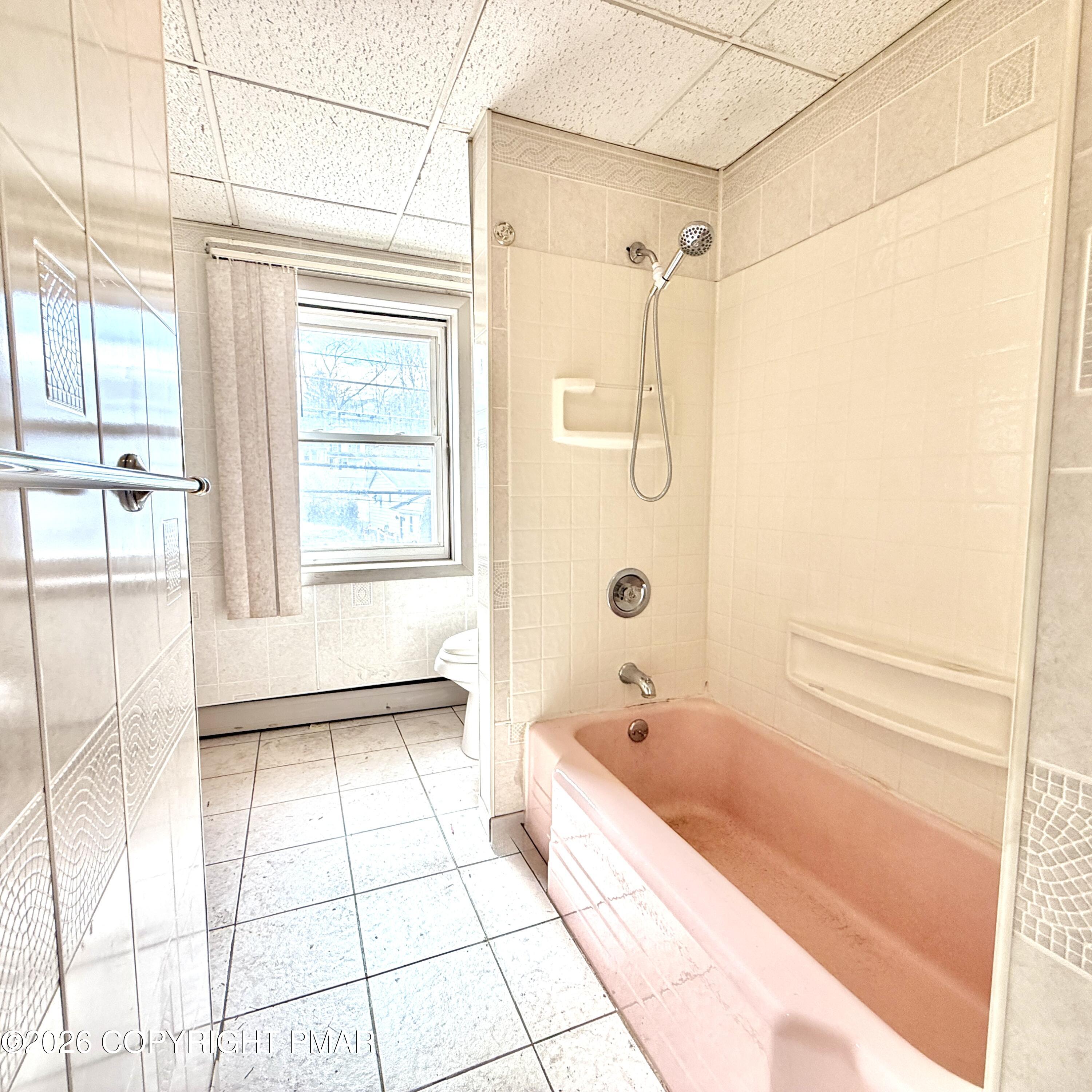 180 Parsonage Street Pittston, PA 18640 - Photo 18 of 19 a bathroom with a bathtub and a shower