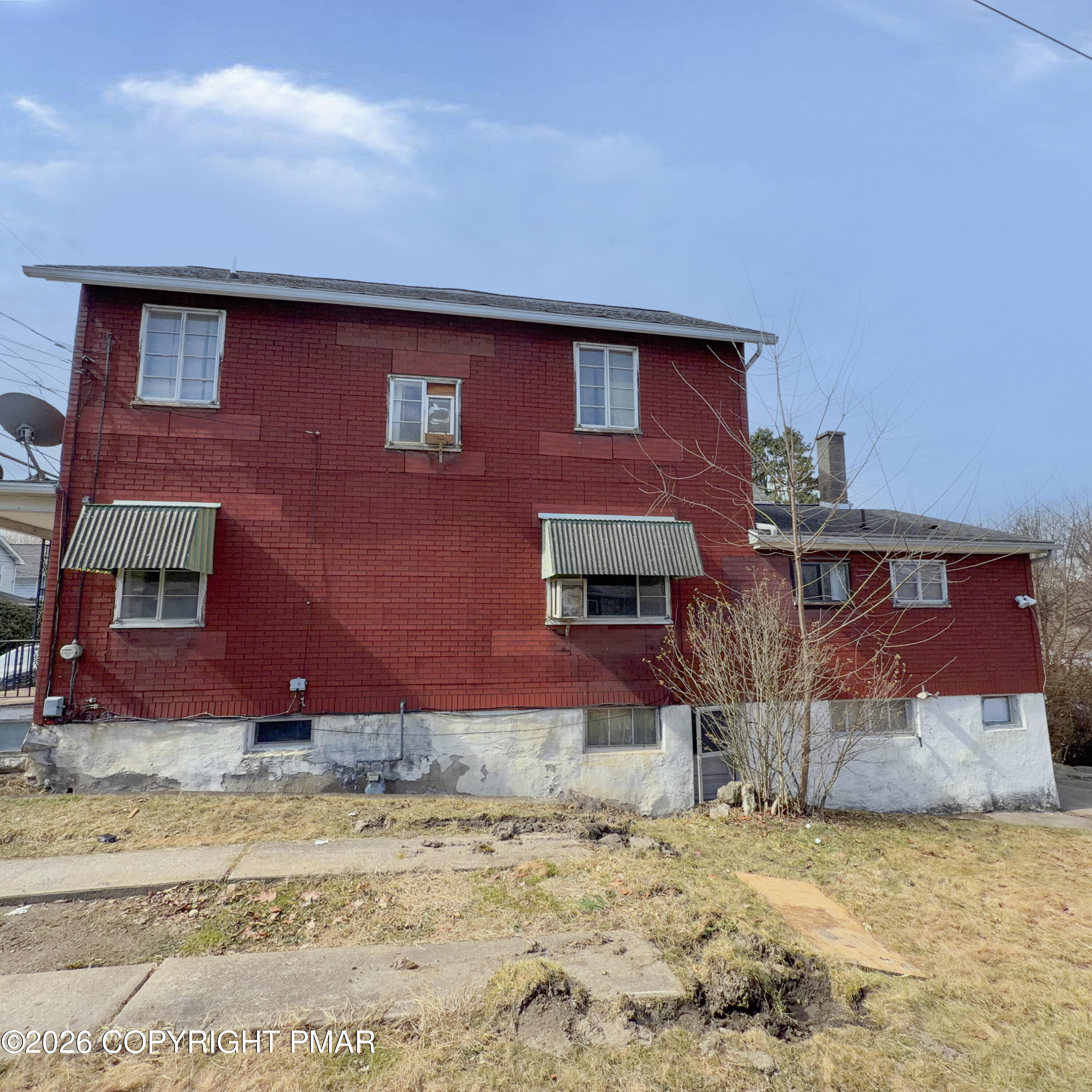 180 Parsonage Street Pittston, PA 18640 - Photo 3 of 19 a front view of a house with a yard