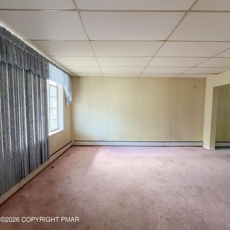 a view of a room with windows