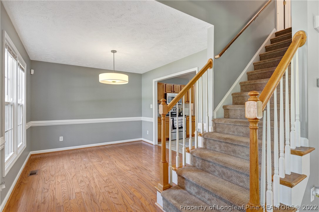 5823 Spreading Branch Road Hope Mills, NC 28348 - Photo 11 of 49 a view of an entryway with wooden floor