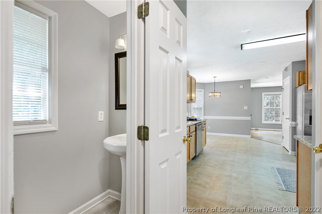 5823 Spreading Branch Road Hope Mills, NC 28348 - Photo 22 of 49 a bathroom with a shower and a sink