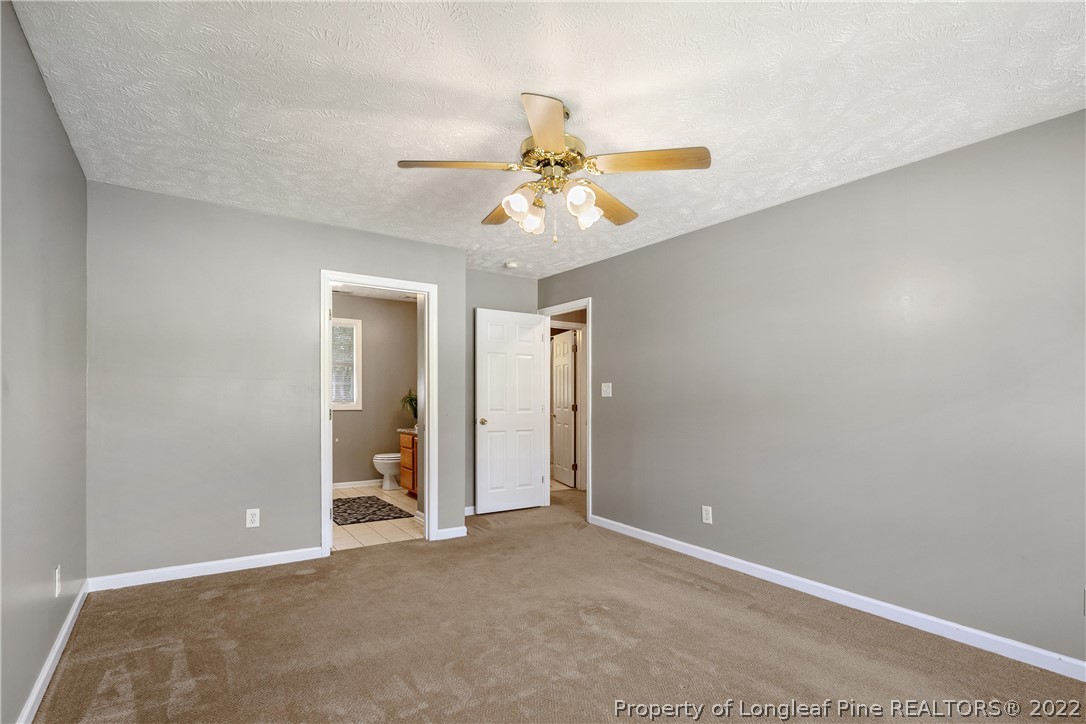 5823 Spreading Branch Road Hope Mills, NC 28348 - Photo 26 of 49 a view of a chandelier fan in a room