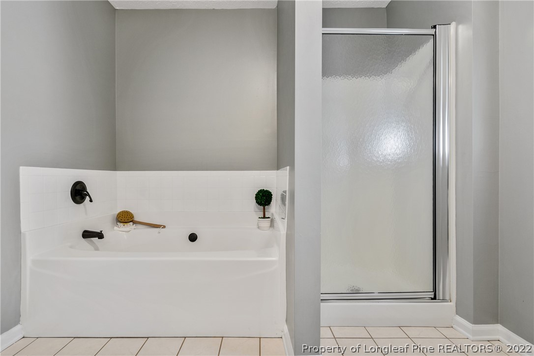 5823 Spreading Branch Road Hope Mills, NC 28348 - Photo 30 of 49 a bathroom with a tub