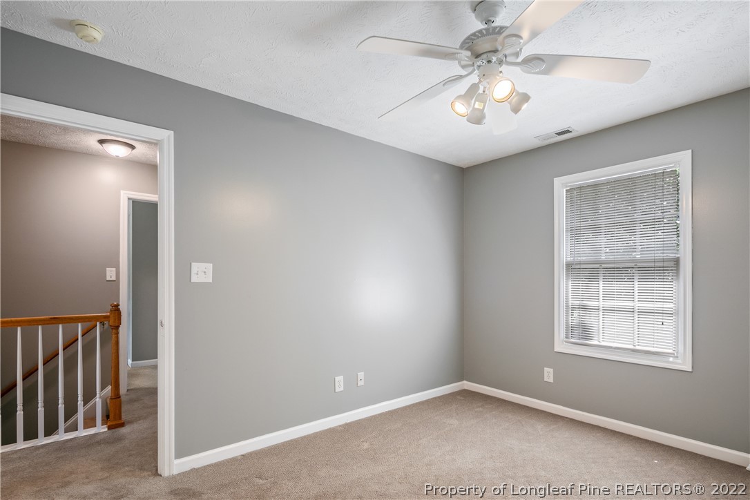 5823 Spreading Branch Road Hope Mills, NC 28348 - Photo 34 of 49 an empty room with windows and fan