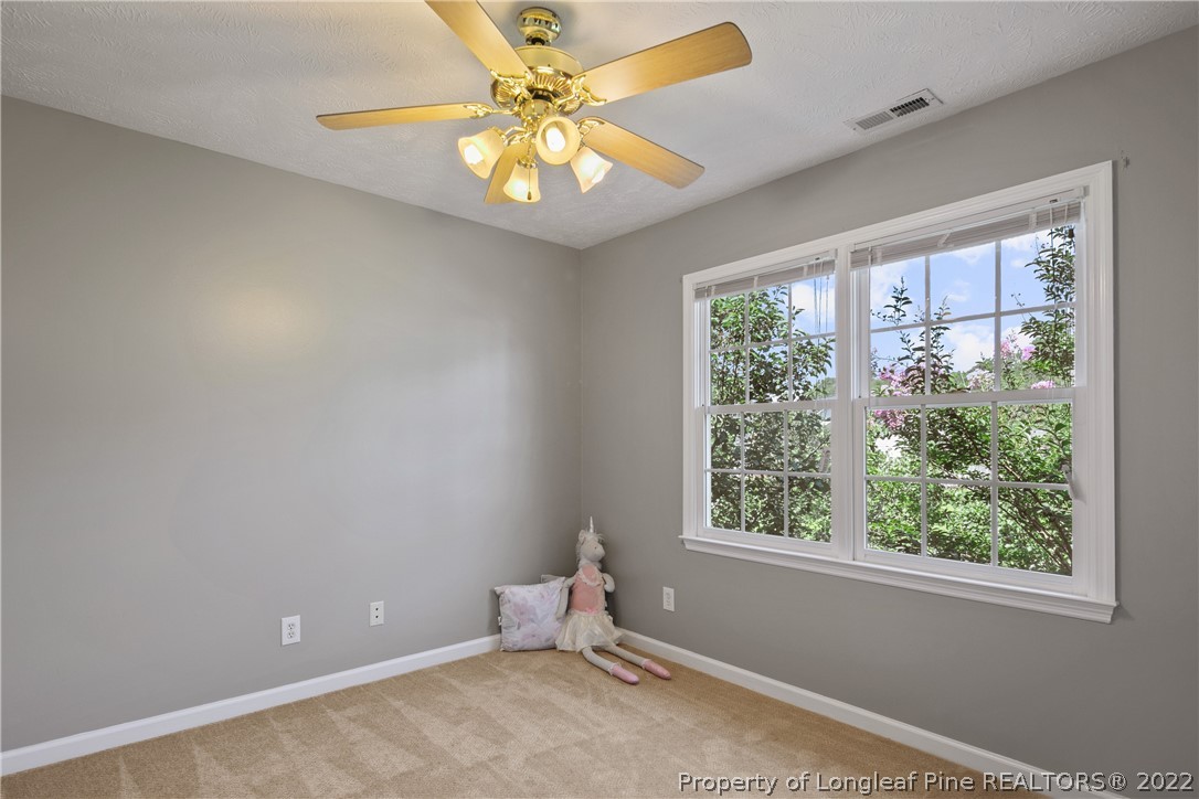 5823 Spreading Branch Road Hope Mills, NC 28348 - Photo 36 of 49 a room with window and ceiling fan