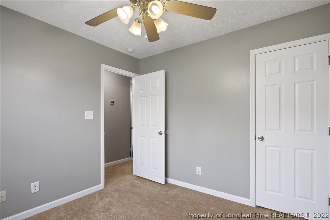 5823 Spreading Branch Road Hope Mills, NC 28348 - Photo 38 of 49 wooden floor in an empty room with a window