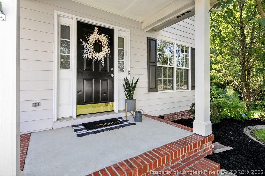 5823 Spreading Branch Road Hope Mills, NC 28348 - Photo 4 of 49 a front view of a house with garden