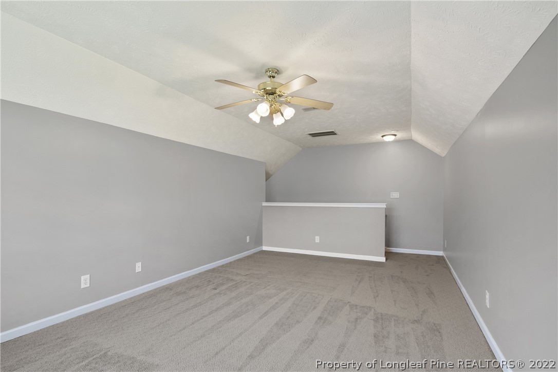 5823 Spreading Branch Road Hope Mills, NC 28348 - Photo 41 of 49 wooden floor in an empty room with a window