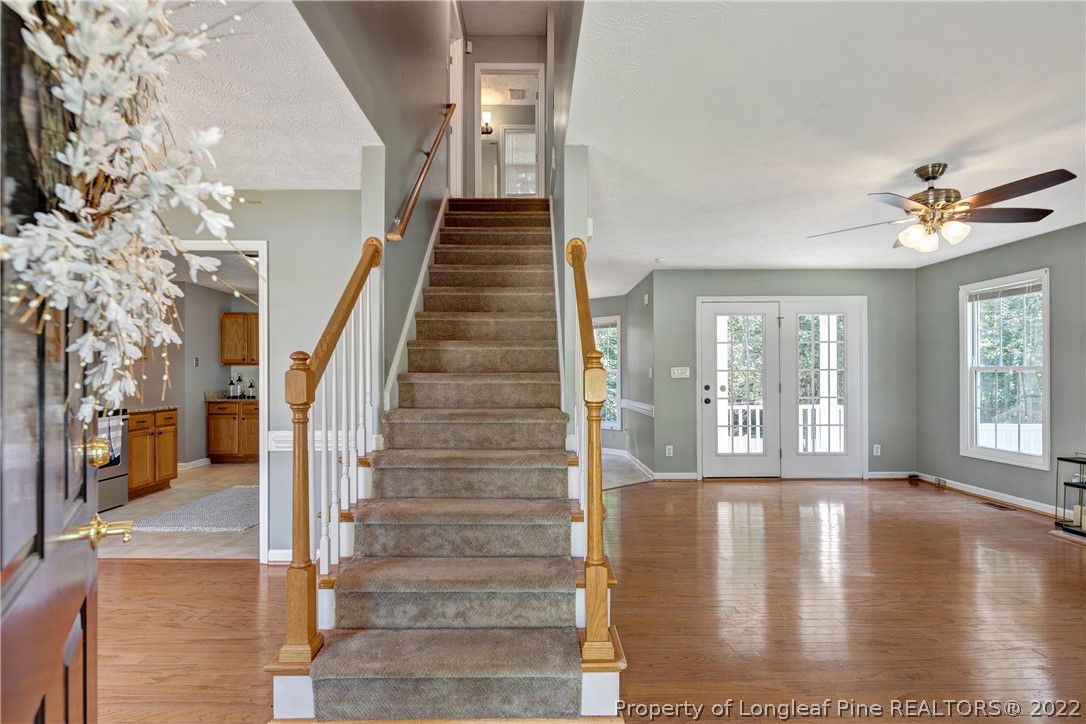 5823 Spreading Branch Road Hope Mills, NC 28348 - Photo 6 of 49 a view of an entryway with wooden floor and a livingroom view