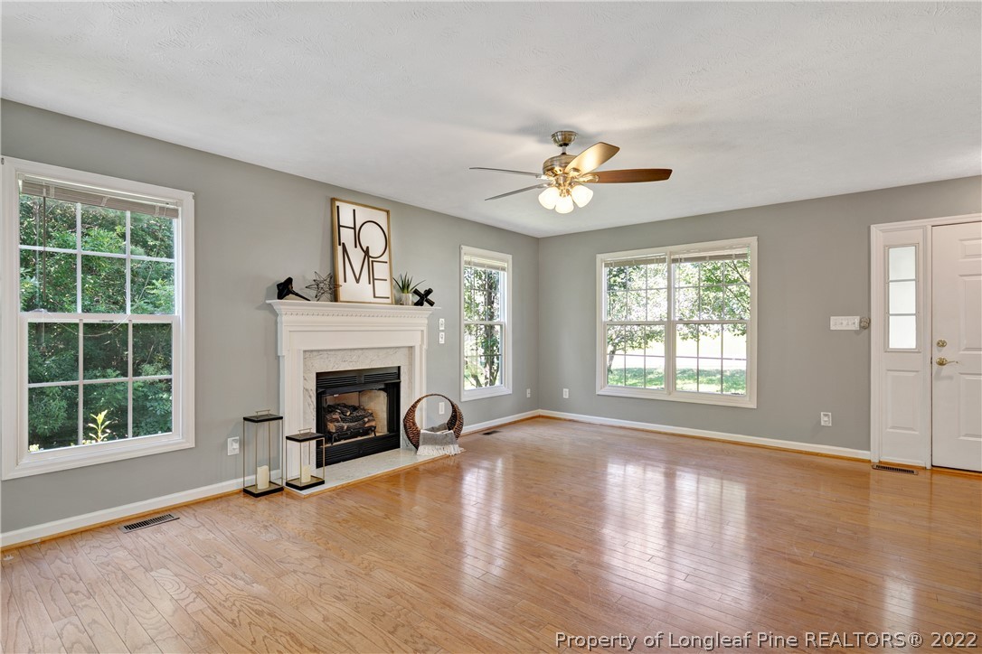 5823 Spreading Branch Road Hope Mills, NC 28348 - Photo 8 of 49 a view of an empty room with window and fire place