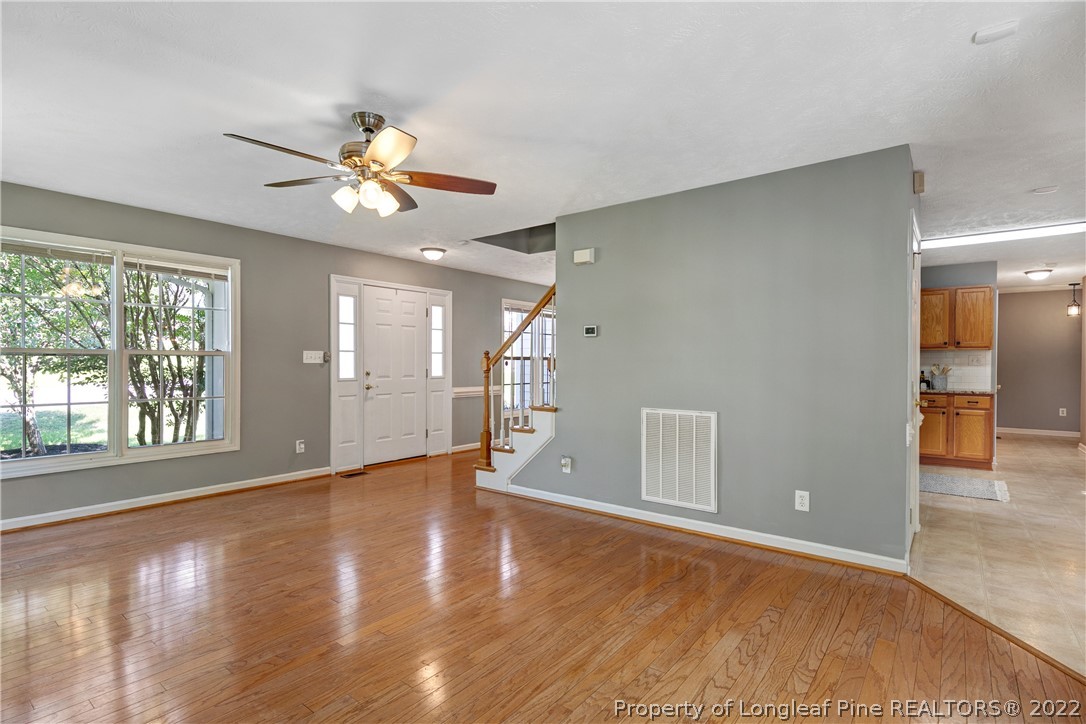 5823 Spreading Branch Road Hope Mills, NC 28348 - Photo 9 of 49 a view of an empty room with window and wooden floor