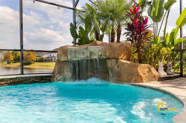 an aerial view of a house with a lake view