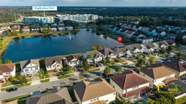 an aerial view of a house with a lake view