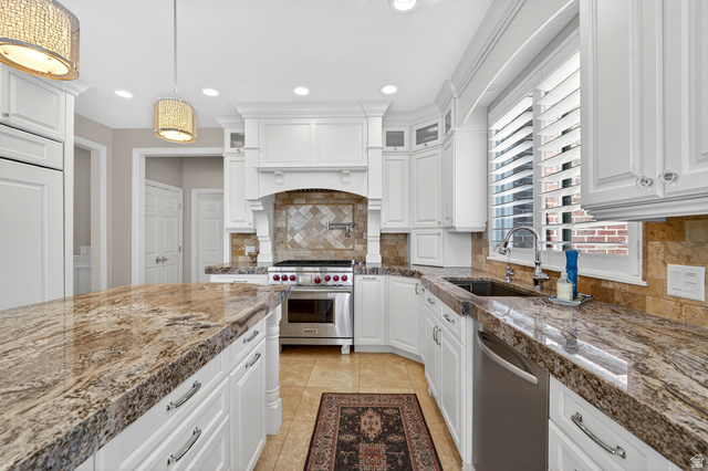 714 Draper Heights Way Draper, UT 84020 - Photo 12 of 88 Kitchen featuring white cabinetry, stainless steel appliances, decorative backsplash, and glass fronted cabinets