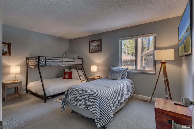 a bedroom with a bed and a couch