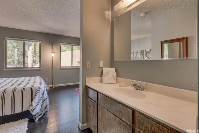a en suite bathroom with a sink and mirror