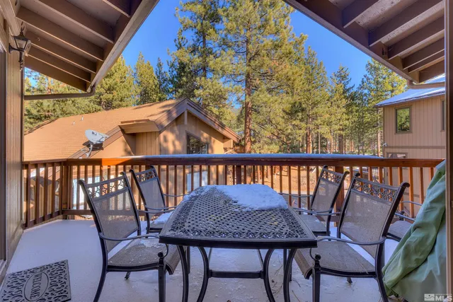 a view of a balcony with furniture