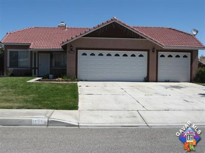 11544 Spring Street Adelanto, CA 92301 - Photo 1 of 15 a front view of a house with a yard