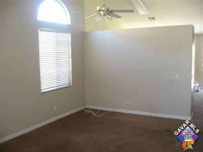 11544 Spring Street Adelanto, CA 92301 - Photo 3 of 15 an empty room with a window