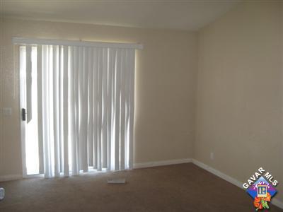 11544 Spring Street Adelanto, CA 92301 - Photo 7 of 15 an empty room with a window