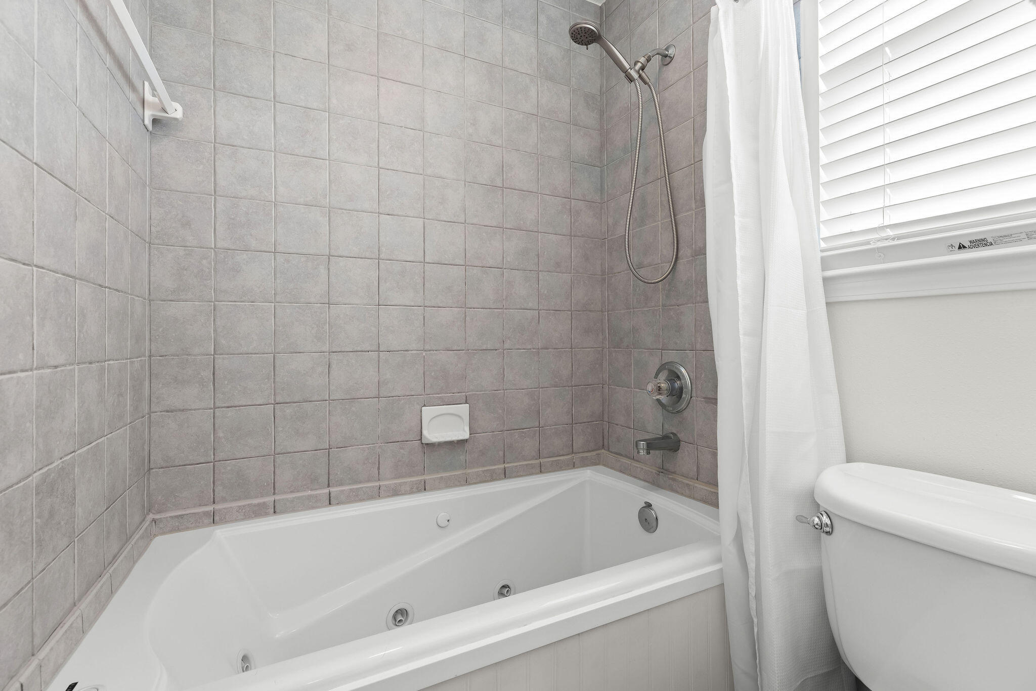 91 Matthew Boulevard Destin, FL 32541 - Photo 85 of 85 a bathroom with a bathtub and a toilet