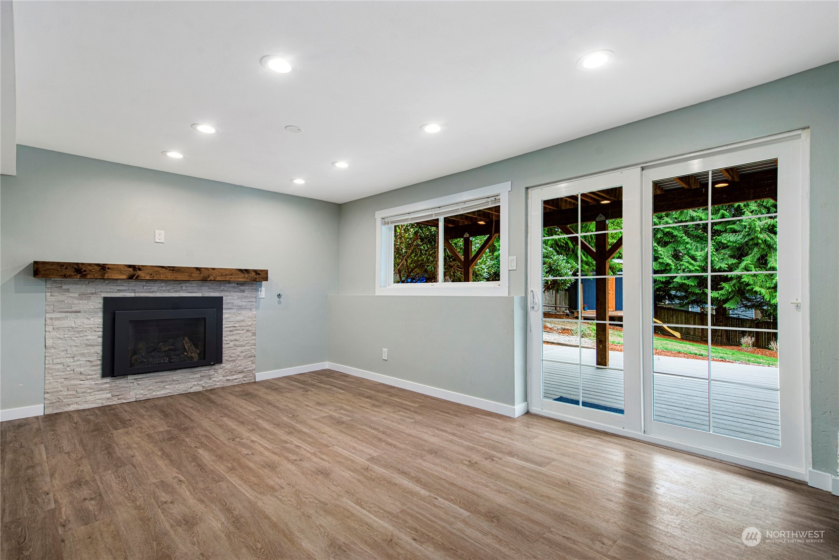 10209 Northeast 198th Street Bothell, WA 98011 - Photo 16 of 28 an empty room with windows and fireplace