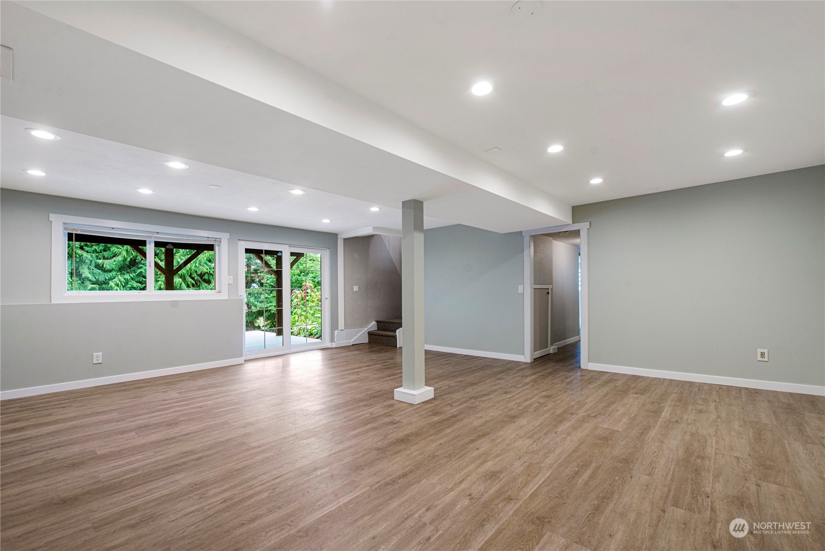 10209 Northeast 198th Street Bothell, WA 98011 - Photo 17 of 28 an empty room with wooden floor and windows