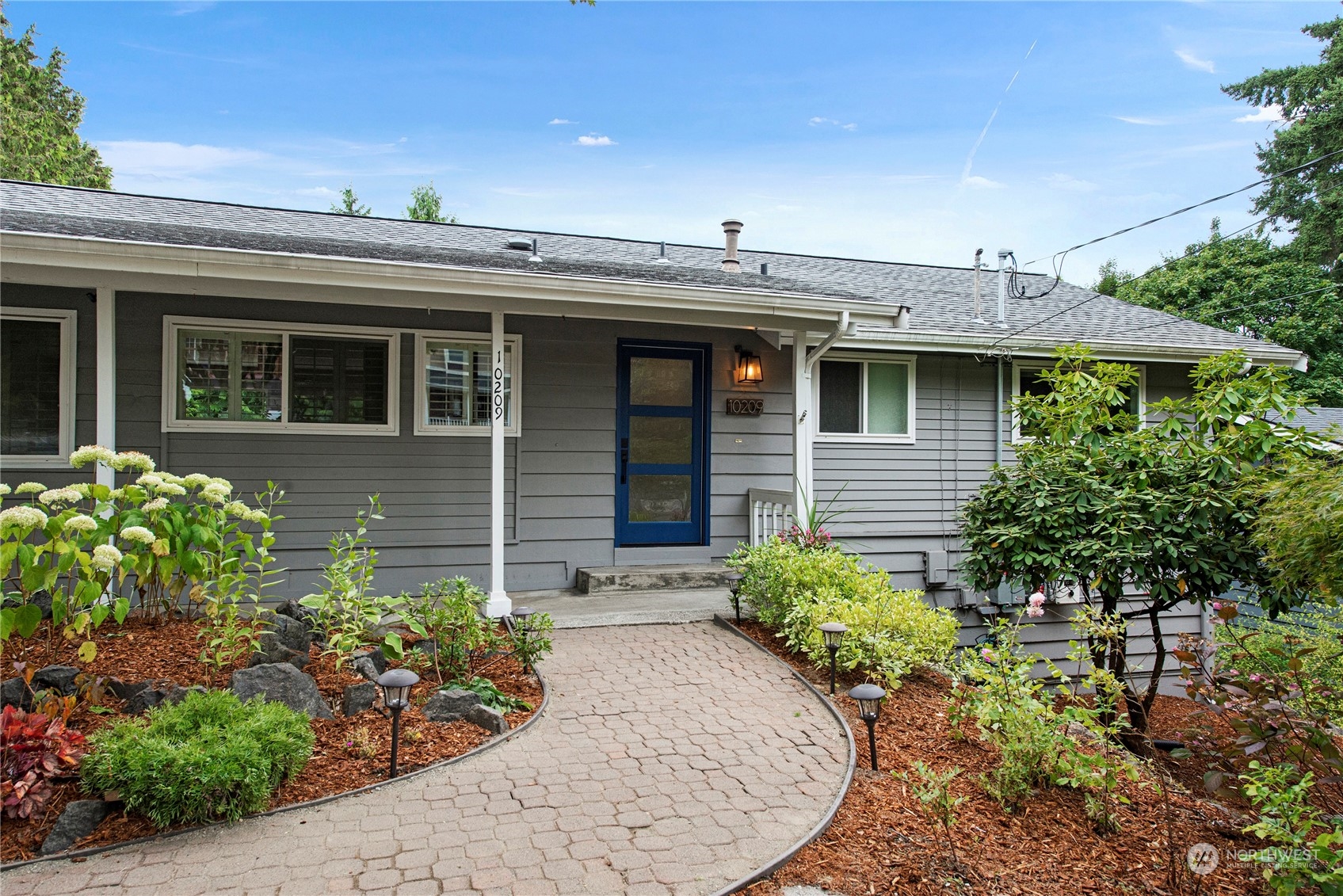 10209 Northeast 198th Street Bothell, WA 98011 - Photo 3 of 28 a view of a house with potted plants